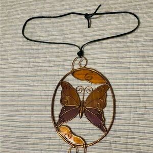 Stained glass oval butterfly sun catcher/window art, 5in w x 5in h, used